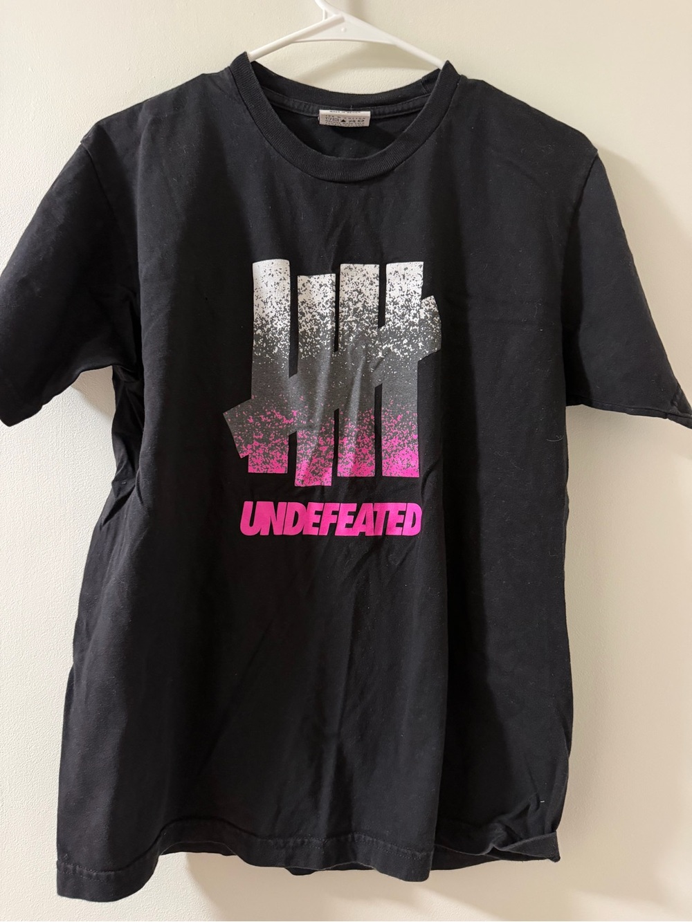 Undefeated Black Graphic Tee with Pink and White Gradient Logo